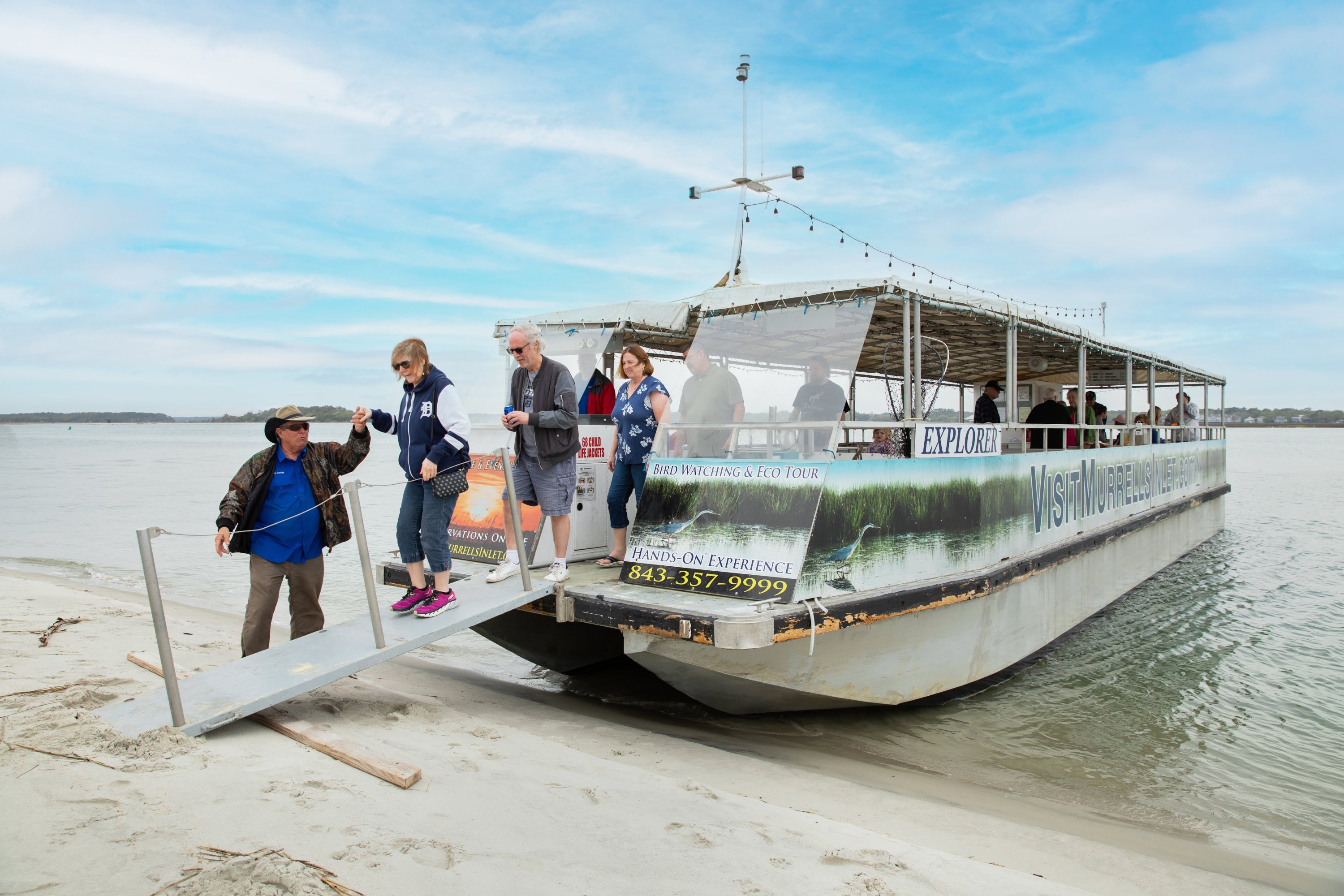 a group of people on a boat in the water
