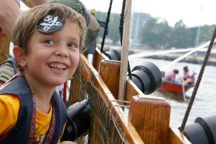 a young child smiling at the camera