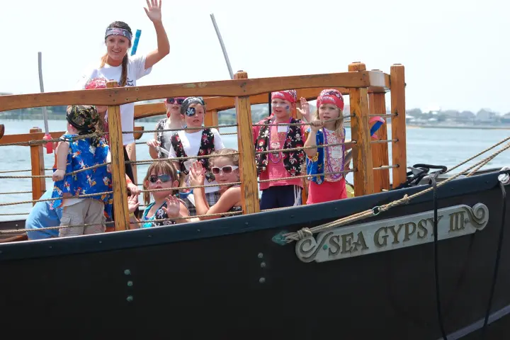 a group of people riding on the back of a boat