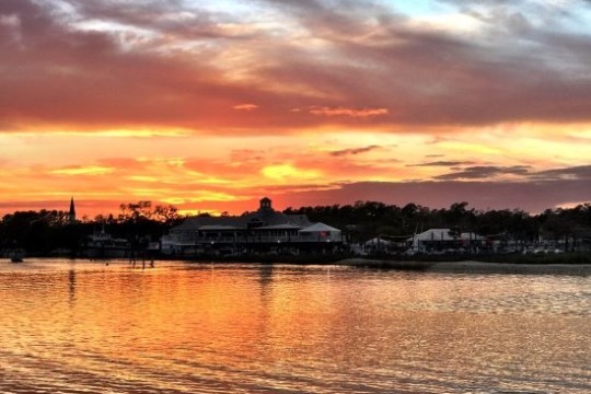 a sunset over a body of water