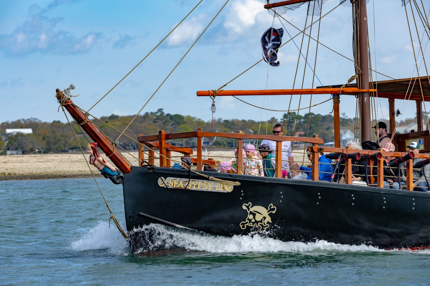 Side view of our pirate ship hosting a pirate event out on the water in Murrells Inlet, South Carolina.